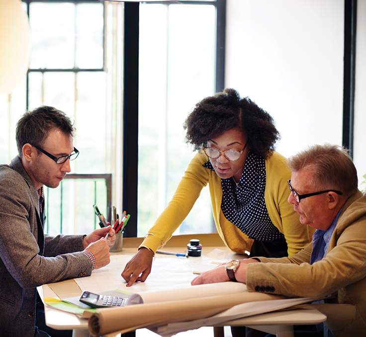 group of coworkers talking strategy